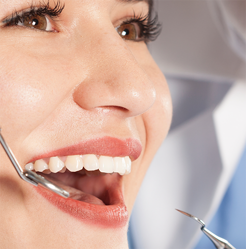 Close up of woman having teeth examined