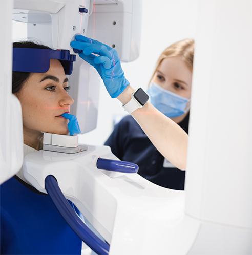 Female patient having dental X rays taken