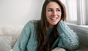 a woman smiling after wearing clear aligners in Midland