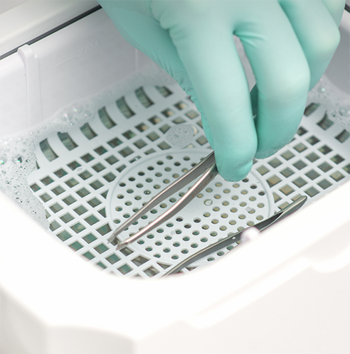 Placing tweezers inside a container