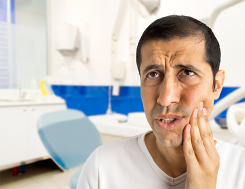 Close up of man in dental office with oral pain