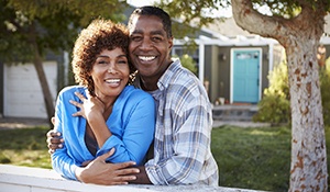 Smiling couple with dental implants in midland