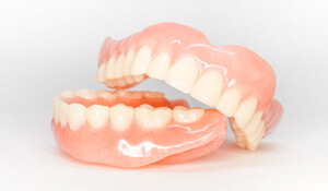 upper and lower full dentures at an angle
