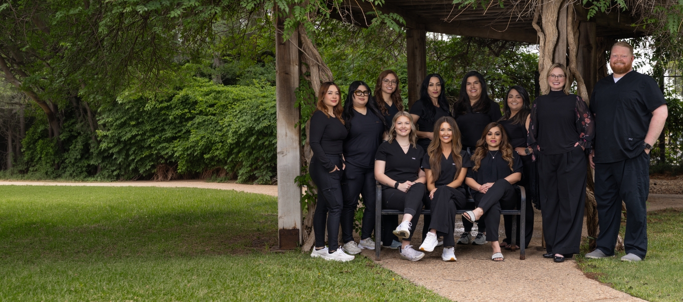 Midland dental team gathered on bench