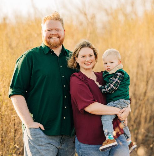 Dr. Boyles in golden field with family