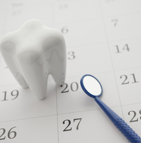 tooth and mirror on a calendar