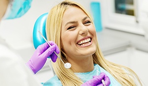 Laughing woman in dental chair