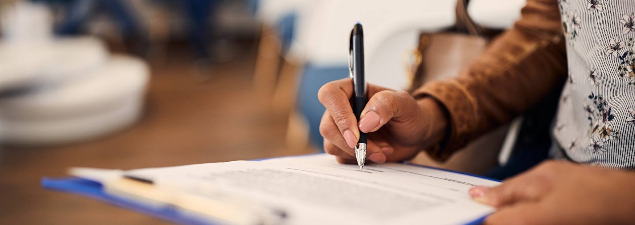 a patient filling out dental insurance forms