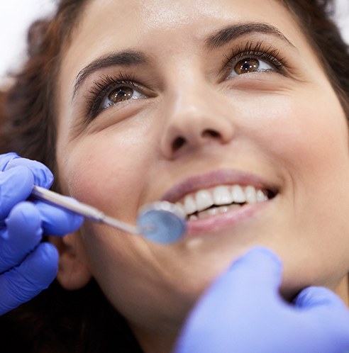 happy patient smiling at the dentist during a checkup