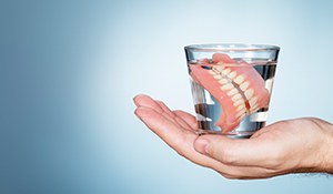 Full dentures in glass of water