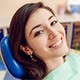 Smiling woman in dental chair