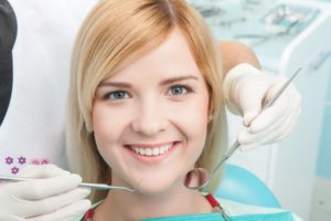 Woman smiling in the dental chair.