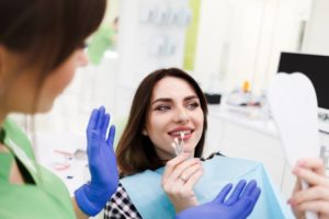 woman deciding between the types of veneers