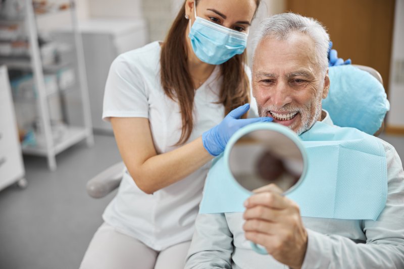 A man happy with his dental implants 